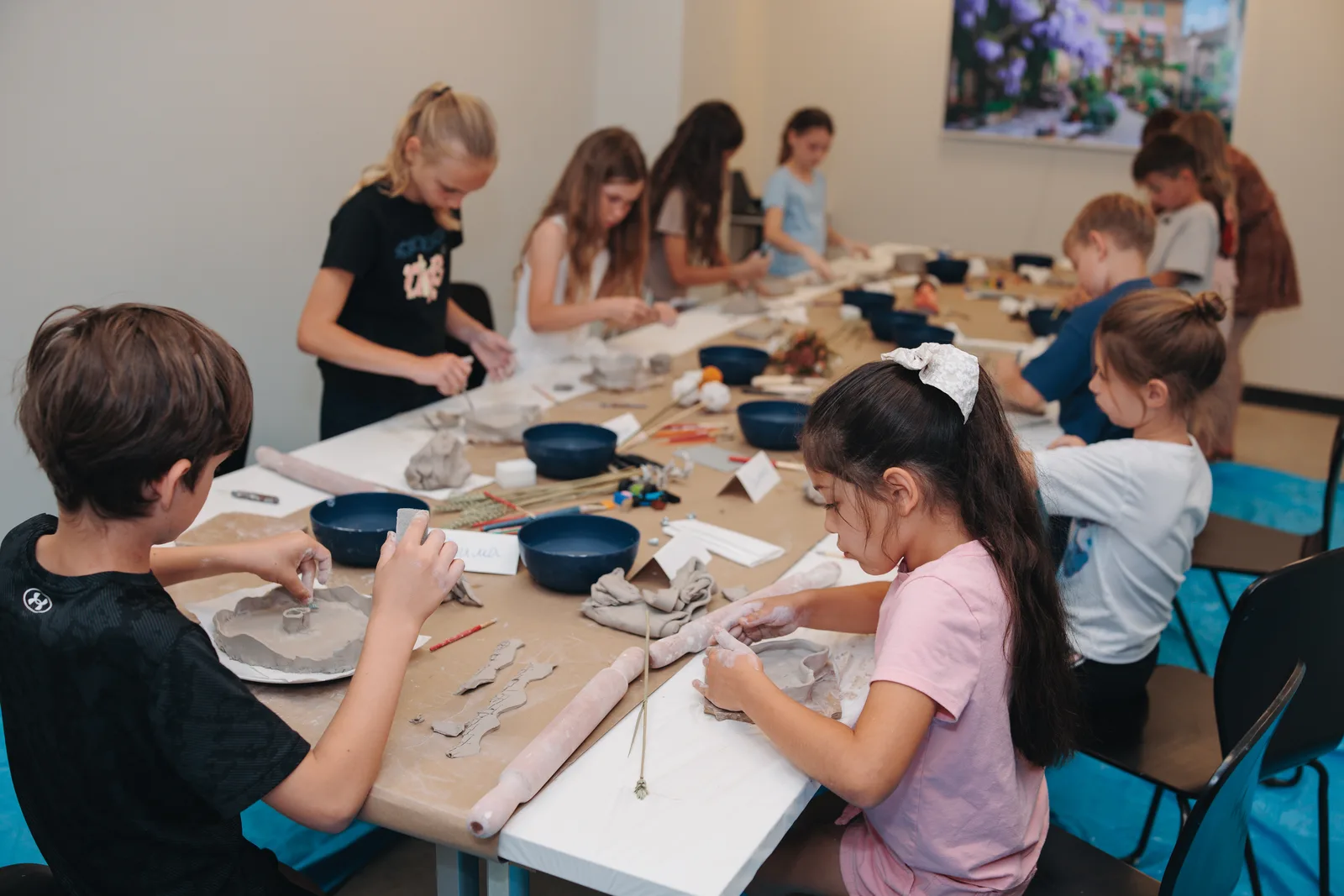 hands in clay, eyes lit up